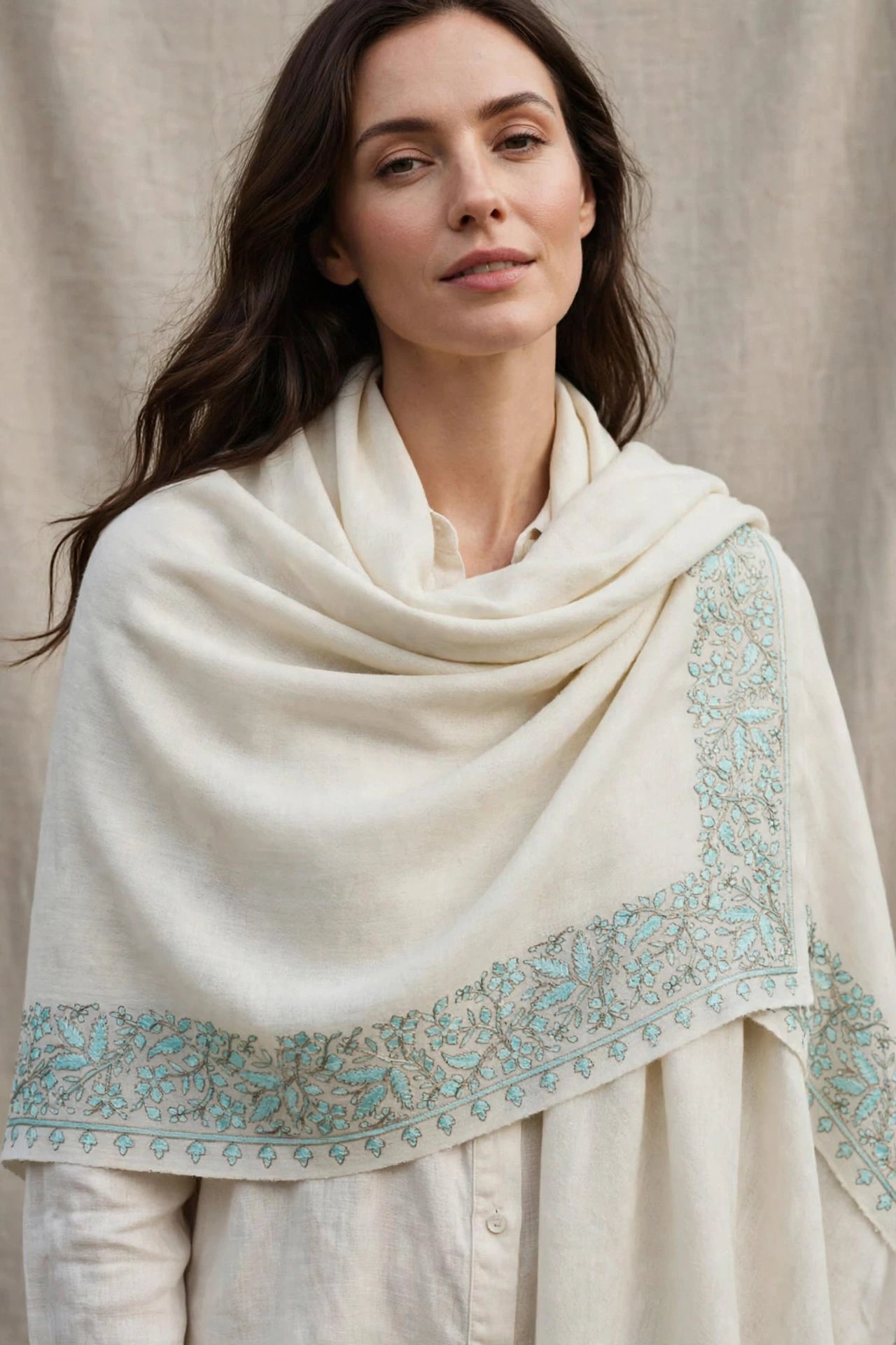Ivory Aqua Floral Border Natural ivory Pashmina finished with delicate pale-aqua and soft-grey floral hand embroidery for a light